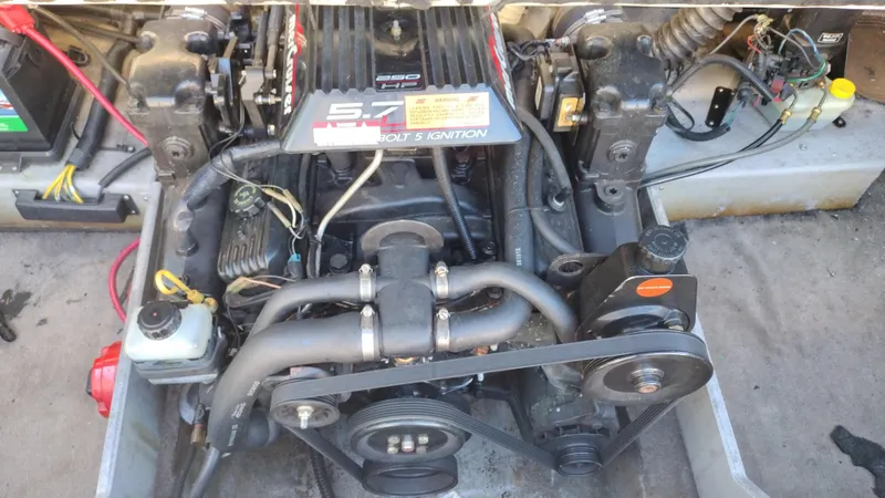 Slide: The Image of 1999 Chaparral 2130 SS engine compartment with visible 5.7L V8 engine components. - 20