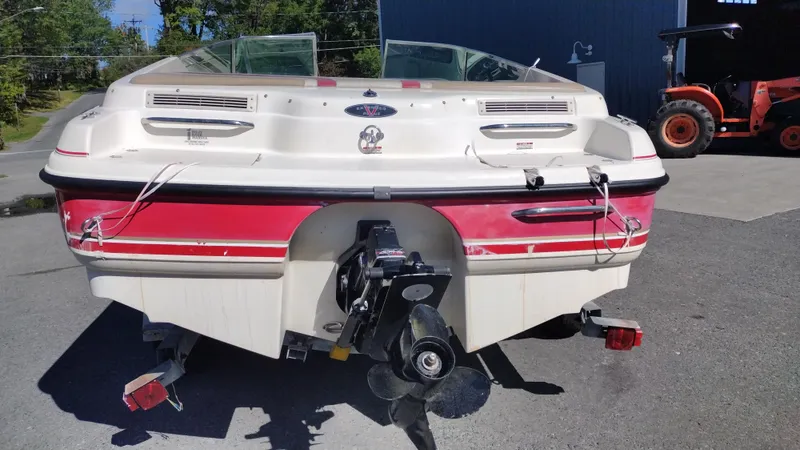 Slide: The Image of 1999 Chaparral 2130 SS boat, rear view, parked outdoors. - 7