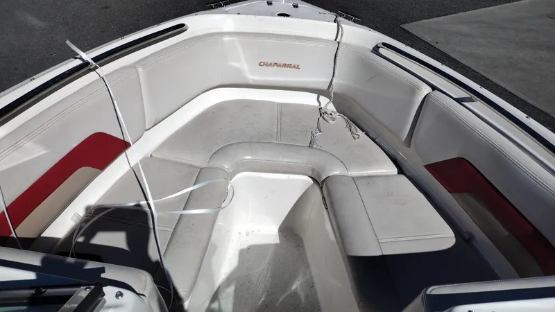 Slide: The Image of 1999 Chaparral 2130 SS boat interior with white and red seating. - 9