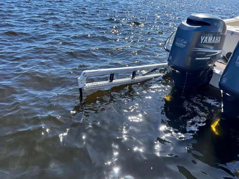 Slide: The Image of 2005 Grady-White 257 Advance boat with Yamaha outboard motors on water. - 12