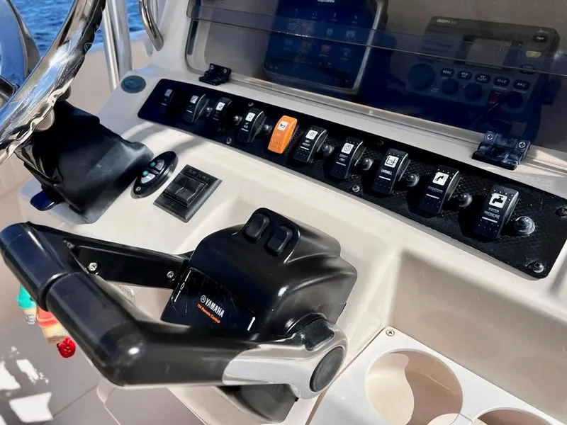 Slide: The Image of Control panel of 2005 Grady-White 257 Advance boat with Yamaha throttle. - 14