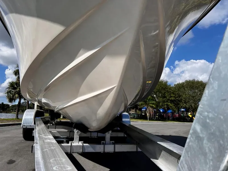 Slide: The Image of 2005 Grady-White 257 Advance boat on trailer, under clear sky. - 17