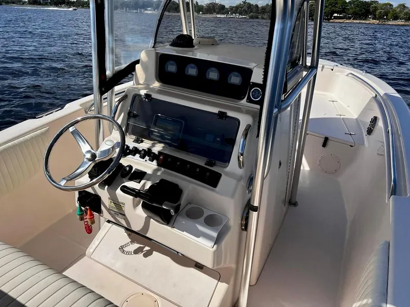Slide: The Image of 2005 Grady-White 257 Advance boat interior with steering wheel and control panel. - 18