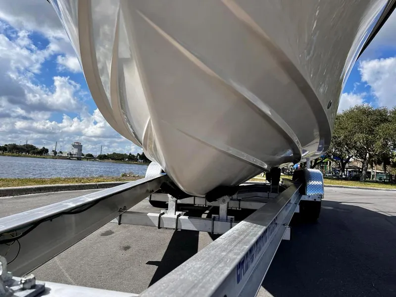 Slide: The Image of 2005 Grady-White 257 Advance boat on trailer, under clear blue sky. - 20