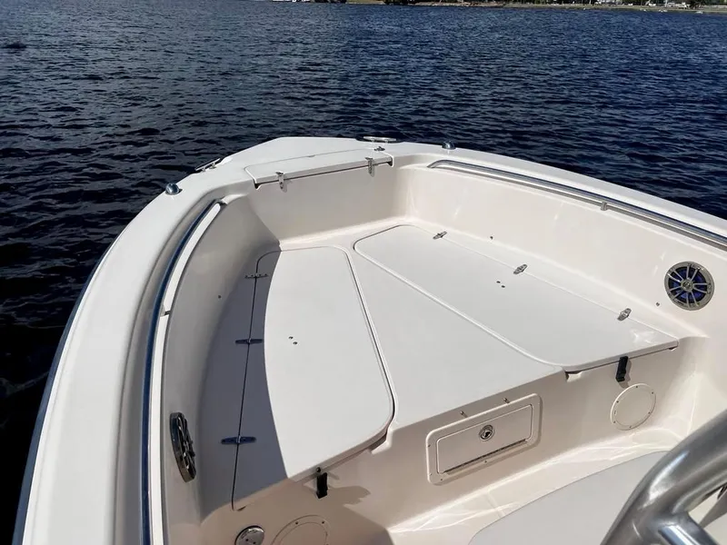 Slide: The Image of 2005 Grady-White 257 Advance boat on calm water, showcasing spacious deck. - 23