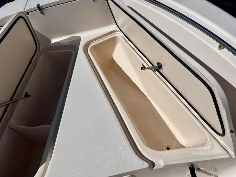 Slide: The Image of Open storage compartments on a 2005 Grady-White 257 Advance boat. - 24