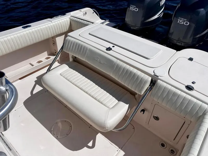 Slide: The Image of 2005 Grady-White 257 Advance boat interior with seating and dual Yamaha 150 engines. - 25