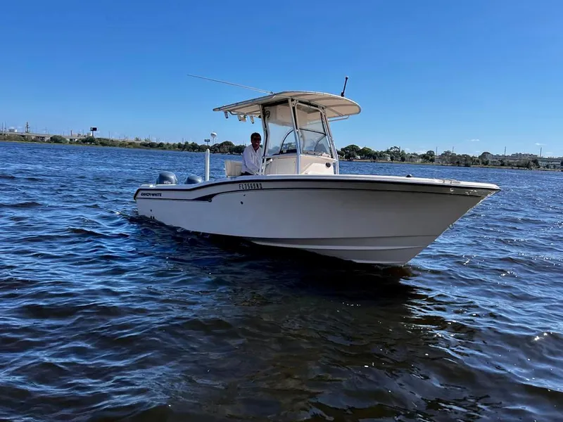 Slide: The Image of 2005 Grady-White 257 Advance boat on water under clear blue sky. - 27