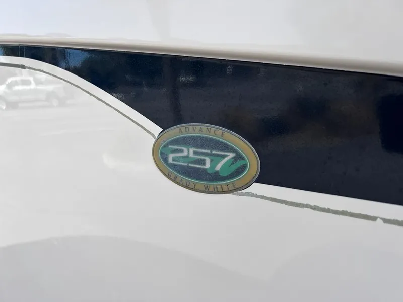 Slide: The Image of Grady-White 257 Advance 2005 boat emblem on white and blue hull. - 28