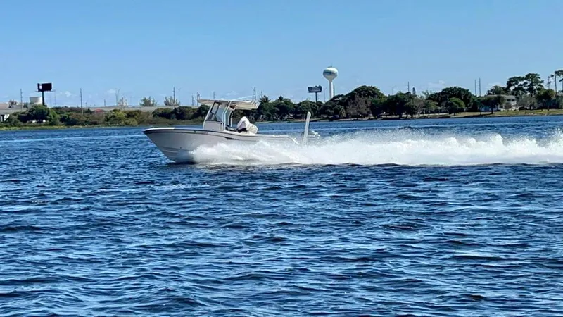 Slide: The Image of 2005 Grady-White 257 Advance boat speeding on a sunny day. - 30