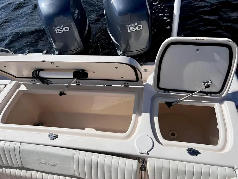 Slide: The Image of 2005 Grady-White 257 Advance boat with Yamaha 150 engines, open storage compartments. - 31