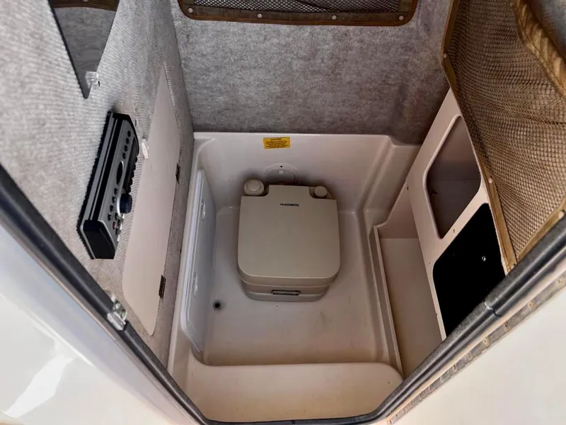 Slide: The Image of 2005 Grady-White 257 Advance boat interior with portable toilet. - 33