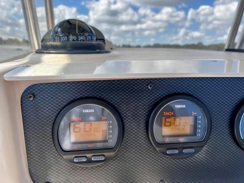 Slide: The Image of Dashboard of 2005 Grady-White 257 Advance boat with Yamaha tachometers and compass. - 37