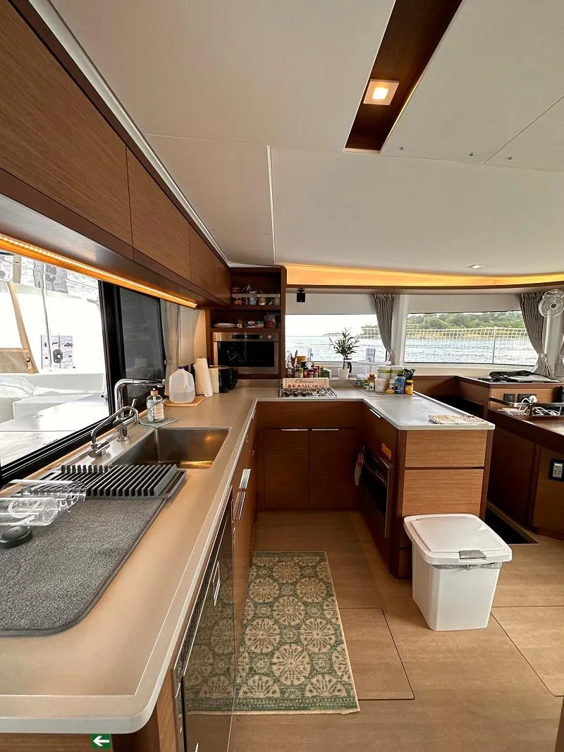 Slide: The Image of Modern kitchen interior of 2022 Lagoon 46 yacht with sleek design and ample counter space. - 20