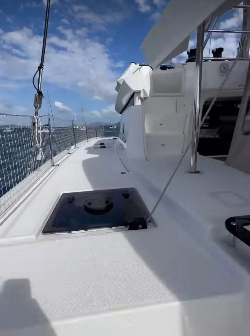 Slide: The Image of 2022 Lagoon 46 yacht deck with clear skies and ocean view. - 5