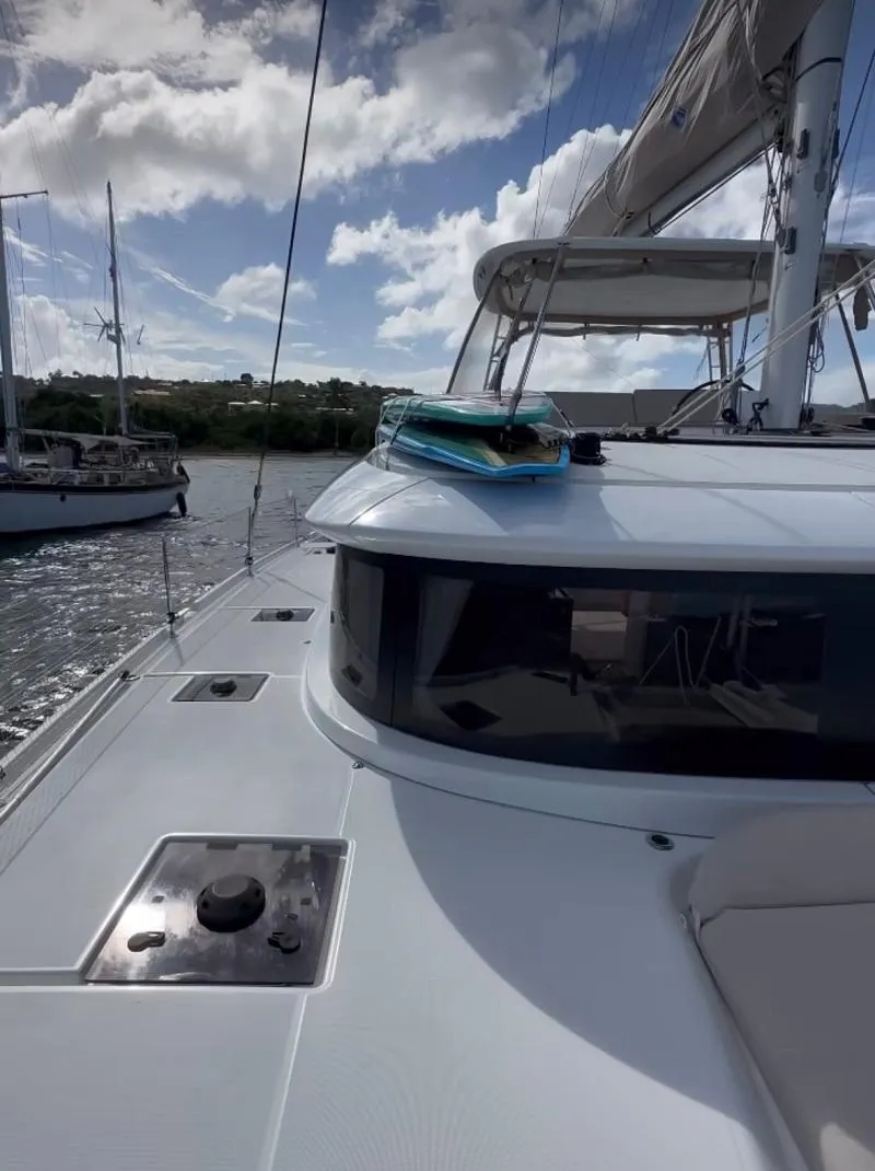 Slide: The Image of 2022 Lagoon 46 catamaran on water, showcasing sleek design and modern features. - 6