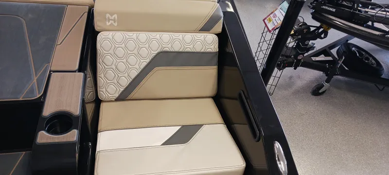 Slide: The Image of 2023 Heyday H22 boat interior with beige and gray seating, modern design. - 10