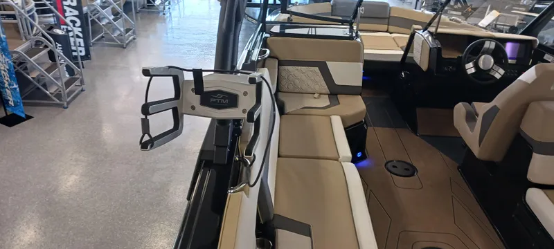 Slide: The Image of 2023 Heyday H22 boat interior with beige seating and modern dashboard. - 15