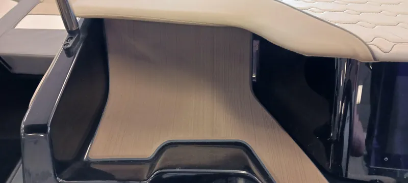 Slide: The Image of 2023 Heyday H22 boat interior with beige seating and sleek black accents. - 19