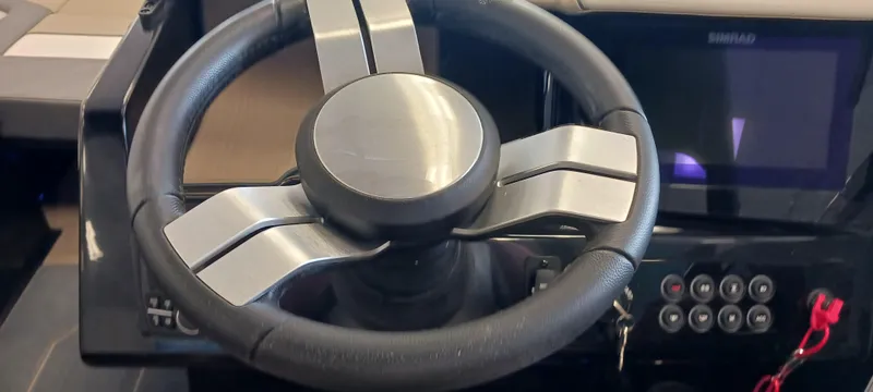 Slide: The Image of 2023 Heyday H22 boat steering wheel and dashboard controls. - 27