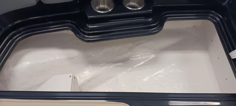 Slide: The Image of 2023 Heyday H22 boat interior storage compartment with cup holders. - 28