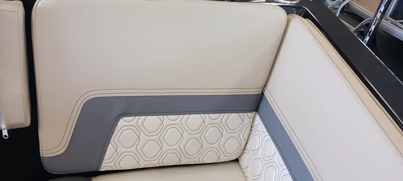 Slide: The Image of 2023 Heyday H22 boat interior with beige and gray upholstery, featuring geometric patterns. - 30