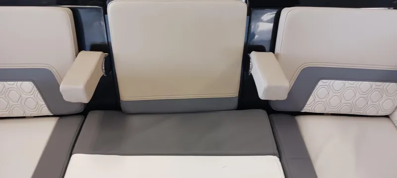 Slide: The Image of 2023 Heyday H22 boat interior seating with armrests, featuring gray and beige upholstery. - 31