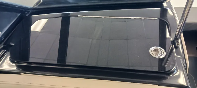 Slide: The Image of 2023 Heyday H22 boat hatch with sleek black finish and metal handle. - 37