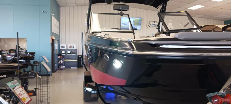 Slide: The Image of 2023 Heyday H22 boat displayed in showroom, sleek black design. - 38