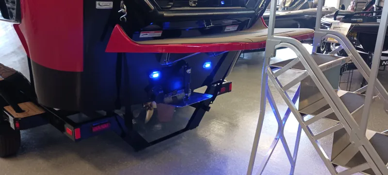 Slide: The Image of 2023 Heyday H22 boat rear view with blue LED lights and metal stairs. - 42