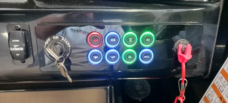 Slide: The Image of Dashboard of 2023 Heyday H22 boat with illuminated control buttons and ignition key. - 43