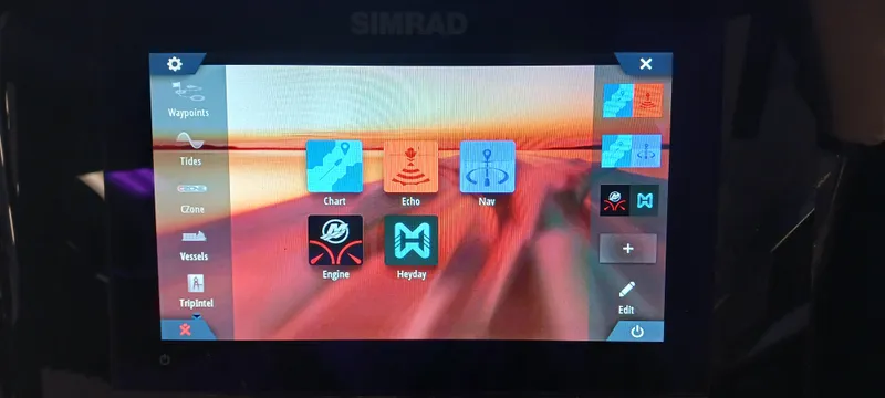 Slide: The Image of Simrad display screen on 2023 Heyday H22 boat showing navigation and engine controls. - 44