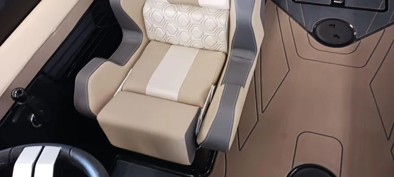 Slide: The Image of 2023 Heyday H22 boat interior with beige and gray seating. - 49