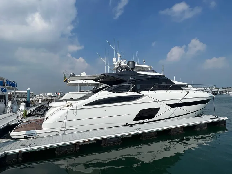 The Image of 2018 Princess V58 yacht docked at marina under clear blue sky. - 0