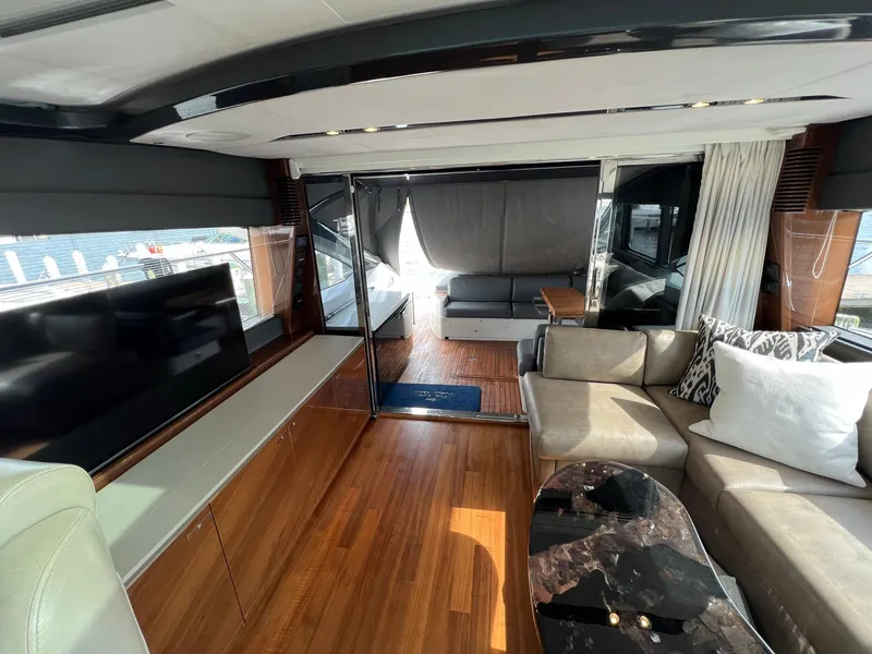 Slide: The Image of Luxurious interior of 2018 Princess V58 yacht with elegant seating and wooden flooring. - 14