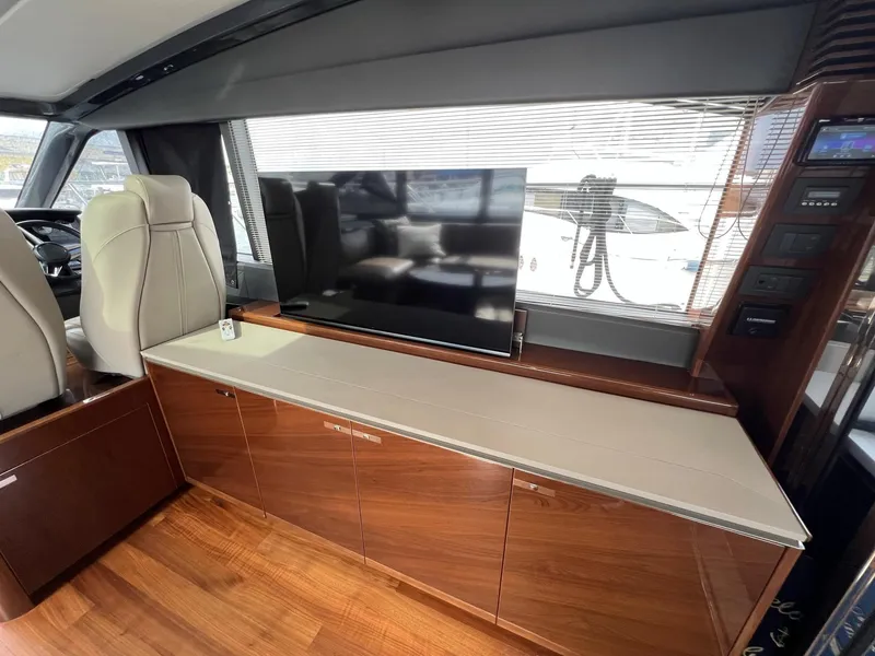 Slide: The Image of Luxurious interior of 2018 Princess V58 yacht with sleek wood flooring and modern seating. - 15