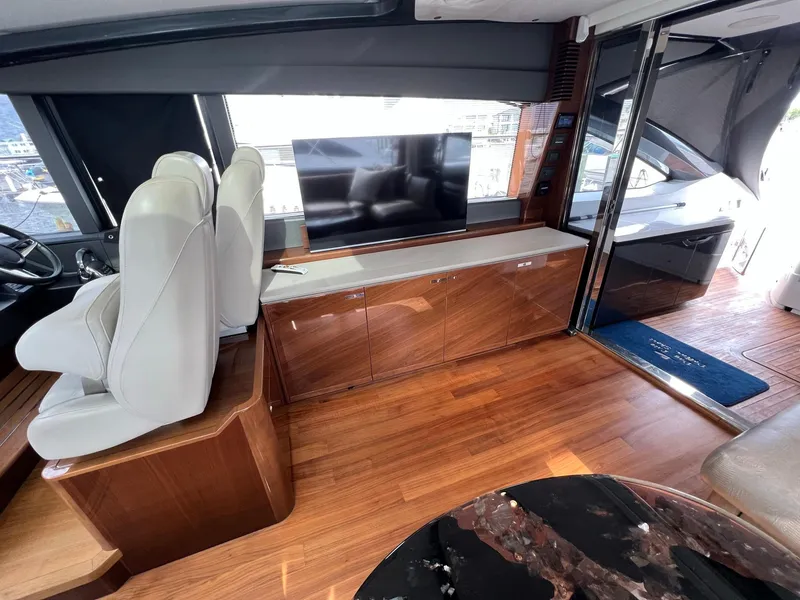 Slide: The Image of 2018 Princess V58 yacht docked, showcasing sleek design and spacious deck. - 17