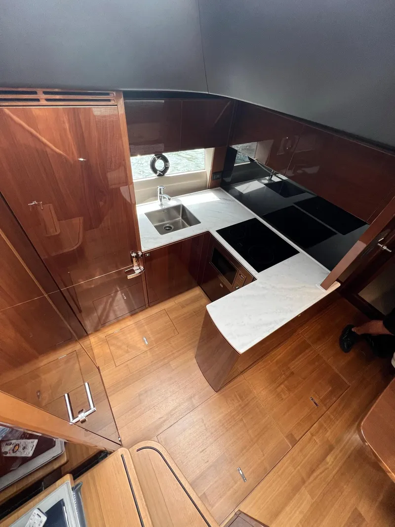 Slide: The Image of Luxury 2018 Princess V58 yacht docked at marina, rear view. - 18