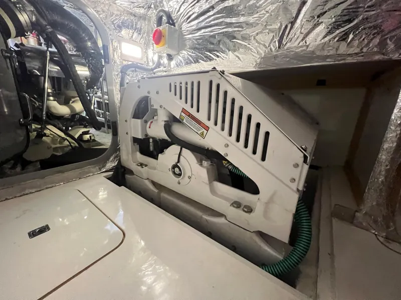 Slide: The Image of Engine room of a 2018 Princess V58 yacht, showcasing mechanical components and wiring. - 22