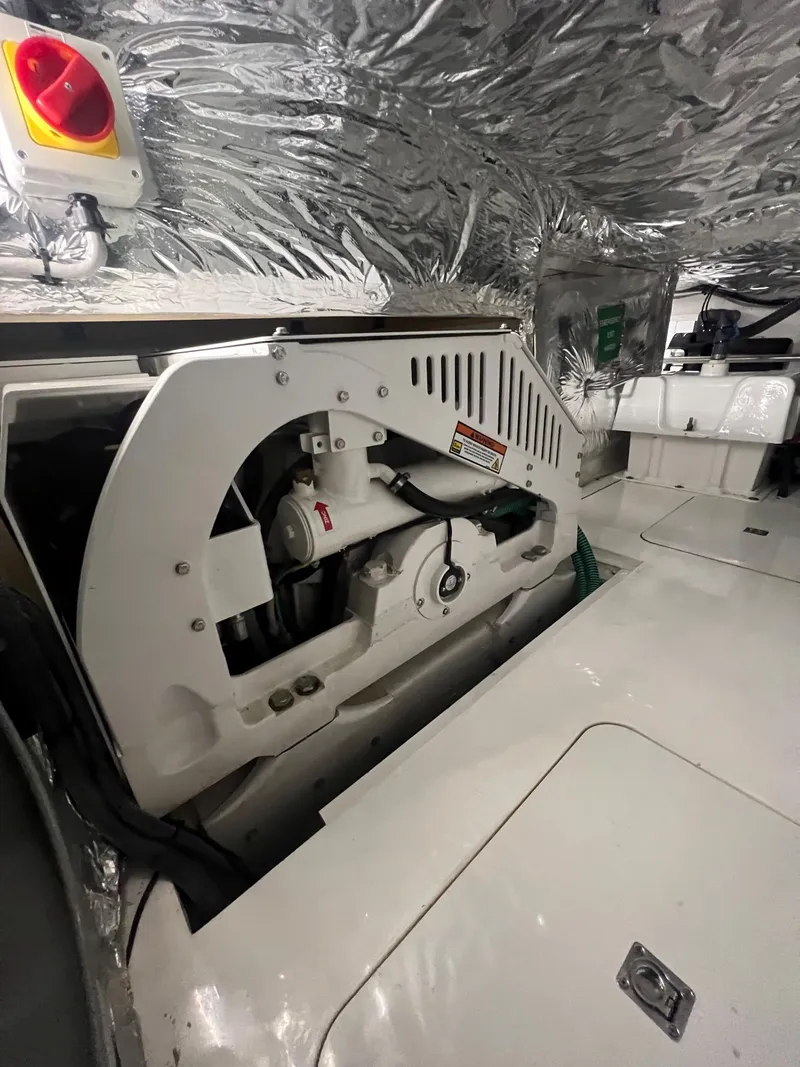 Slide: The Image of Dolphin battery charger in a 2018 Princess V58 yacht engine room. - 26