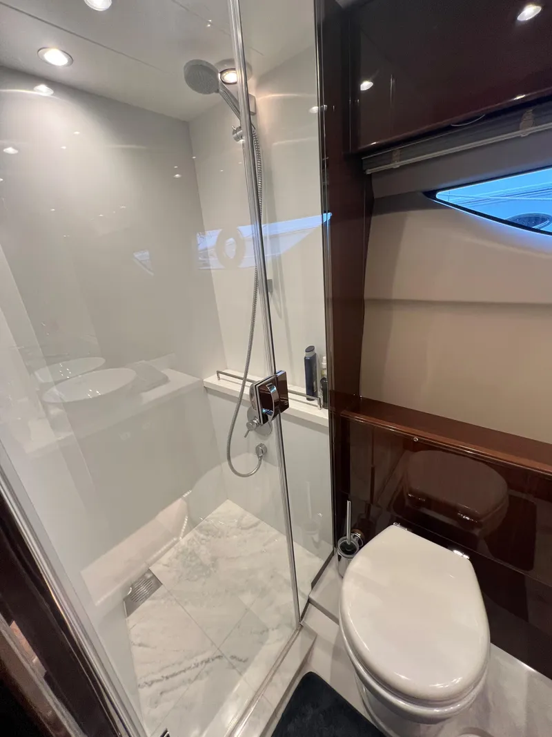 Slide: The Image of 2018 Princess V58 yacht interior with TV and wooden cabinet. - 36