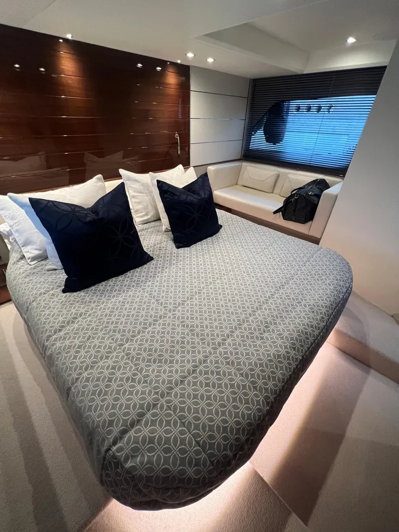 Slide: The Image of Luxurious 2018 Princess V58 yacht bedroom with modern design and ambient lighting. - 40
