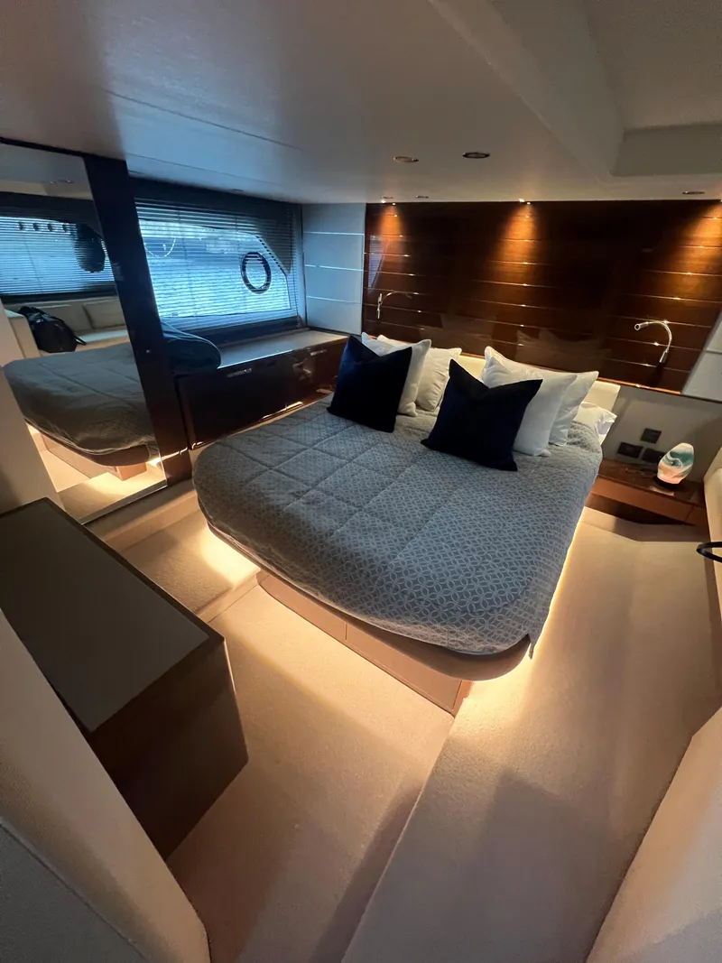 Slide: The Image of Luxurious interior of 2018 Princess V58 yacht with elegant seating and wooden finishes. - 42