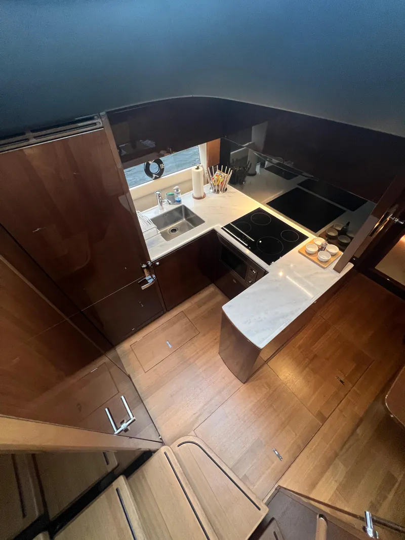 Slide: The Image of Dashboard of a 2018 Princess V58 yacht with digital and analog displays. - 45