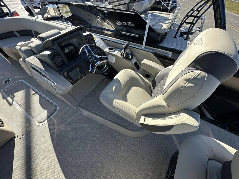 Slide: The Image of Luxurious 2023 Silver Wave 2410 SW7 JS boat interior with plush seating and modern dashboard. - 5