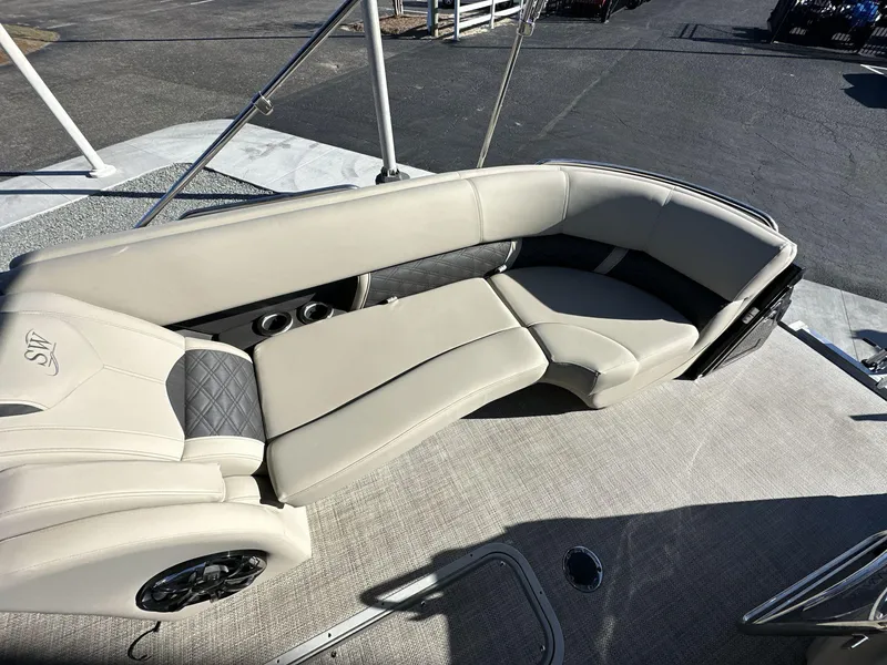 Slide: The Image of 2023 Silver Wave 2410 SW7 JS boat interior with beige seating and modern design. - 9