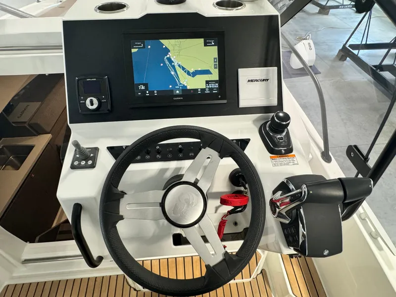 Slide: The Image of 2023 Beneteau Flyer 9 SUNdeck helm with navigation display and controls. - 11