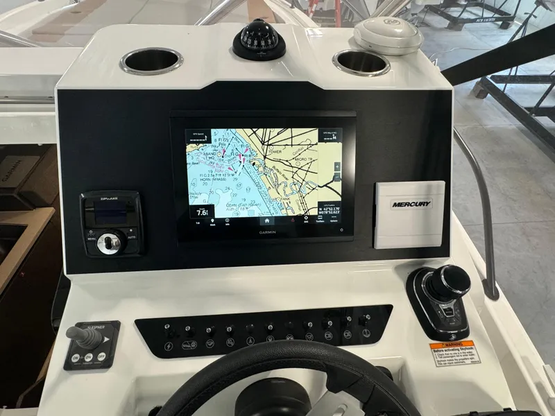 Slide: The Image of 2023 Beneteau Flyer 9 SUNdeck dashboard with navigation system and controls. - 12