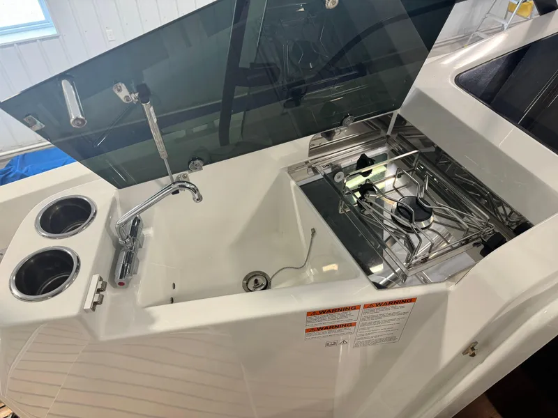 Slide: The Image of 2023 Beneteau Flyer 9 SUNdeck kitchen area with sink and stove. - 13