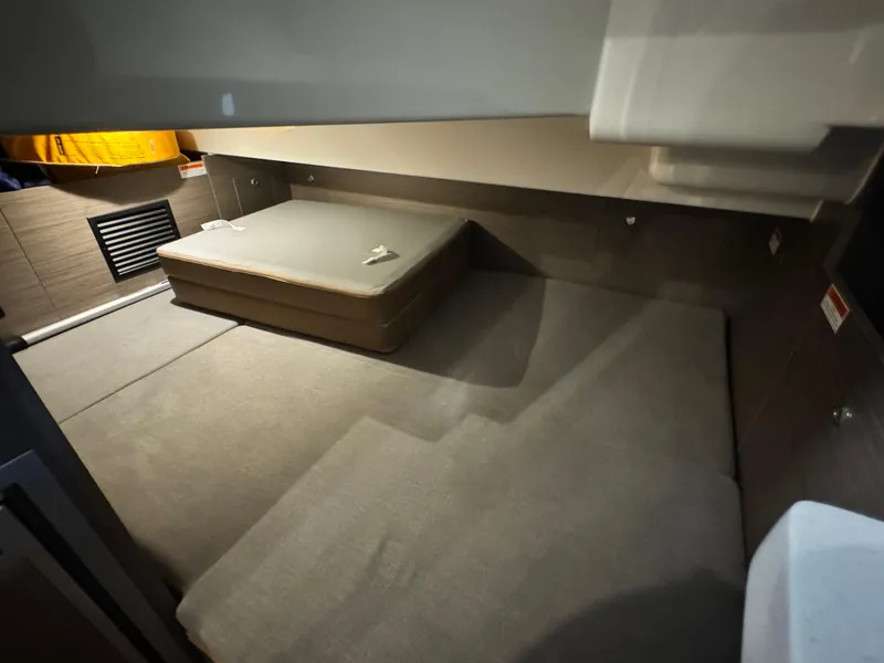 Slide: The Image of 2023 Beneteau Flyer 9 SUNdeck cabin interior with bed and storage space. - 16